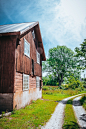 Vertical shot of a big wooden barn in the countryside