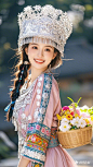 一位年轻的姑娘身穿苗族服饰，衣服上有轻纱飘逸，衣服上有丰富民族花纹，带着精致的苗族帽子，一只手挎着一个小竹篮，竹篮里有颜色鲜艳的鲜花，五官精致，妆容精致，眼睛有神，笑的很开心活泼，干净且清晰的线条，柔