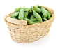 Fresh green peas in basket on a white background.