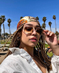 Photo shared by Ray-Ban on January 06, 2023 tagging @junecharles. May be an image of 1 person, braids, sunglasses and outdoors.