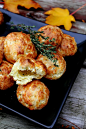 Cheddar-Thyme Gougères with creamy goat cheese filling