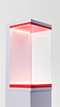 **White gold on red merchandise display stand