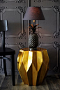 interior detail - pineapple lamp on old gold carambola side table - on dark grey