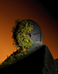 This may contain: a clock on top of a hill with trees growing out of it