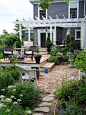 pergola, layered decks, brick patio, stone path, wicker seating: 