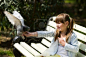 An adorable picture of a pigeon and a young girl.