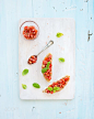 Tomato and basil bruschetta sandwich on white wooden serving board over rustic blue background, top 