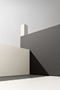 This may contain: an empty room with white and grey walls