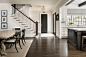 Large elegant single-wall dark wood floor and brown floor eat-in kitchen photo in Atlanta with an integrated sink, recessed-panel cabinets, white cabinets, granite countertops, white backsplash, subway tile backsplash, stainless steel appliances, two isla