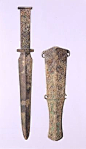 Short Sword and Sheath with Animal Motifs Date: 7th&#;82116th century B.C. Culture: Northeast China Medium: Bronze Dimensions: Sword: L. 11 7/8 in. (30.2 cm) Sheath: L. 8 1/2 in. (21. 6 cm) Classification: Metalwork Credit Line: Gift of Mr. and Mrs. E