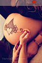 Her prenatal belly henna begins at her blessingway