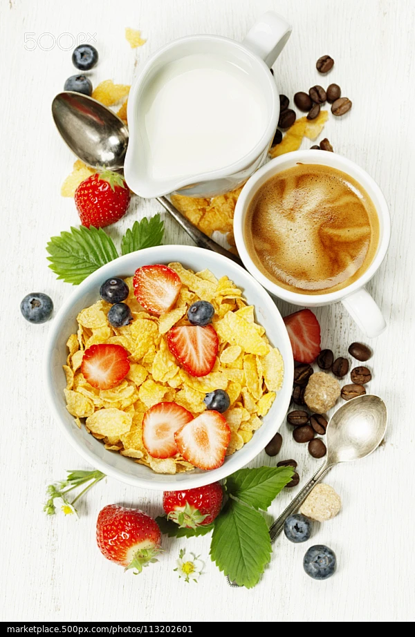 Breakfast with coffee, corn flakes, milk  and berry - stock photo