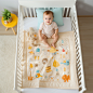 MCA_Real_photo_shooting_bright_crib_scene_baby_playing_in_the_c_5