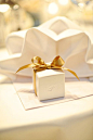 So elegant and minimalist white monogrammed  wedding favor box with gold ribbon bow #goldwedding #gold #weddingfavors #diywedding #giftwrapping
