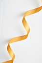 Close-Up Of Ribbon Over White Background