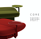 three different colored stools sitting next to each other