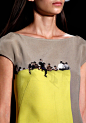 Akris - Photography textiles on a dress that looks like people are sitting on top of a ledge!