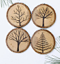 Set of 4 Wood Burned Tree Coasters by ForageWorkshop on Etsy. A really nice drink coaster set, the backs have a Cork liner so they won't scratch your table top or get hooked up with the table cloth. Nice simple clear designs ;): 