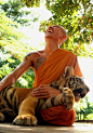 laughing monk with tiger