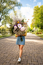 Woman in the spring holding bouquet of flowers