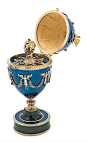 Fabergé Easter Egg Silver, engraved and partially gilded with blue guilloché enamel, oval cabochon rubies, round and oval cabochon tourmalines, and rose cut diamonds; with nephrite jade pedestal. Egg topped by an Imperial double-headed Romanov eagle, and 