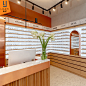 时尚品牌眼镜集合店展示柜带灯靠墙眼镜展柜木质层板眼镜展示架台