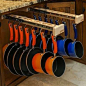 A new storage solution from Glideware revolutionizes your kitchen cabinets by letting you organize all your pots and pans vertically. This award-winning product is also available for closets.: 