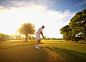 Caucasian golfer holding club at ball on course by Gable Denims on 500px