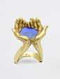 KEVIN COATES RING OF HANDS CUPPING WATER IN 18K GOLD AND OPAL