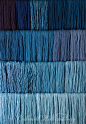 Studio photography of various colors of yarn dyed at the Weaver's shop in Colonial Williamsburg. Shot for book by Max Hamerick on dyeing textiles; Blue dyed with Indigo Photo by Barbara Temple Lombardi