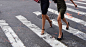 two women walking on pedestrian lane