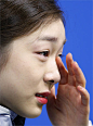 SOCHI Russia Kim Yu Na of South Korea sheds a tear while speaking to reporters following an award ceremony for the women's figure skating event at...