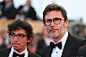 5月16日，凭借电影《艺术家》摘得奥斯卡最佳影片奖的法国导演米歇尔·阿扎纳维修（右）亮相戛纳国际电影节开幕式红地毯