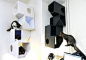 Catissa! Angular boxes stack on top of each other and attach to the wall at any height providing a cat climbing and perching structure that takes no floor space. Designed by Russian industrial design studio Mojorno. Unfortunately, shipping costs from Russ