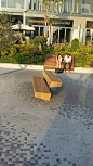 Trapecio bench designed by Antonio Montes and Montserrat Periel.  Two glolam beams make up a large bench that offers an array of possibilities for urban recreational areas. Large element that offers numerous uses and is perfect for public and private recr