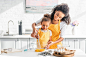 Smiling african american mother help stock photo containing female and smiling