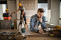Male architect drawing improvements on housing plan at construction site.详情 - 创意图片 - 视觉中国 VCG.COM