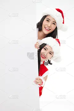 穿圣诞服的年轻女人拿着白板