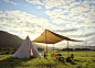 tent on grass against sky - camping tent  stock pictures, royalty-free photos & images