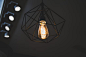 Turned on Black Framed Incandescent Bulb Pendant Lamp