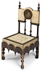 A Carlo Bugatti carved walnut and painted vellum, copper, pewter, and brass side chair circa 1902