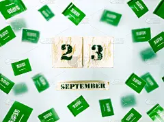 沙特阿拉伯国庆日。Al-Yaom-ul-Watani。9月23日。黑色背景上的纸小旗。自由、爱国、记