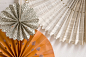 paper wheel decor backdrop - so THAT's what these are called!!!