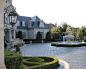 SYMMETRY : Magnificent French Formal Estate in Dallas, Texas featuring limestone, balustrade, tile pool, bluestone, negative edge pool, boxwood parterre, fountains and pavestone driveways. Architecture by Fusch