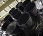 Falcon 9 first stage in hangar; upgraded Merlin engines close-up :  