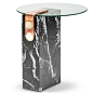 The marble patch side table is part of the Patch collection by Egg Designs. Patch makes reference to the brass fixing mechanism which was design by Egg Designs and is used on many of their furniture pieces. The side table has a base of marble with a