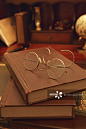 Old-fashioned glasses on a stack of old books创意图片素材 - Amana RF