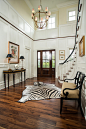 Inspiration for a large transitional dark wood floor and brown floor entryway remodel in Charleston with a dark wood front door and yellow walls