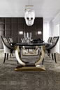 A gorgeous dining set that offers outstanding style and comfort providing the ultimate sophisticated dining experience. A stylish contemporary table with a high gloss black lacquered top, supported by two striking polished stainless steel u shaped plinth
