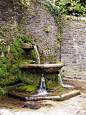 Water fountain outside the walls of Lismore Castle gardens in Ireland.